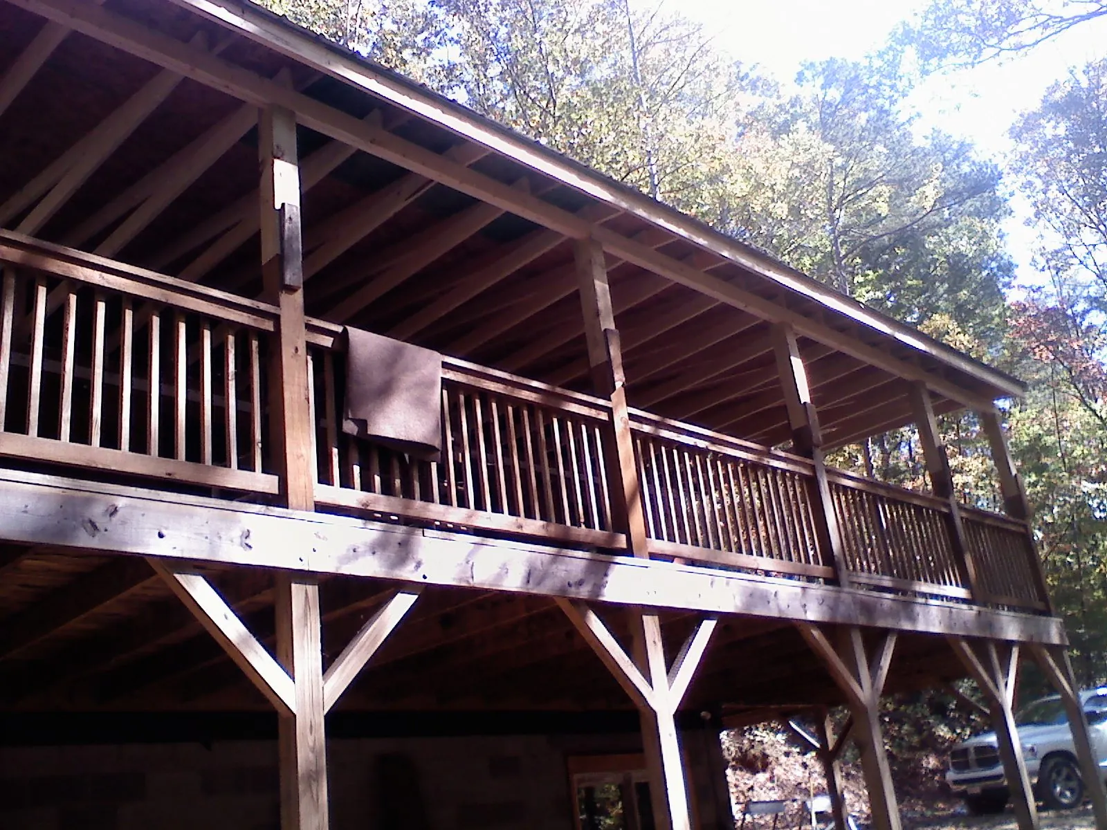 Timber framing under a new elevated porch and deck — Roof Leak Repair in Onsted by Roofing Brothers
